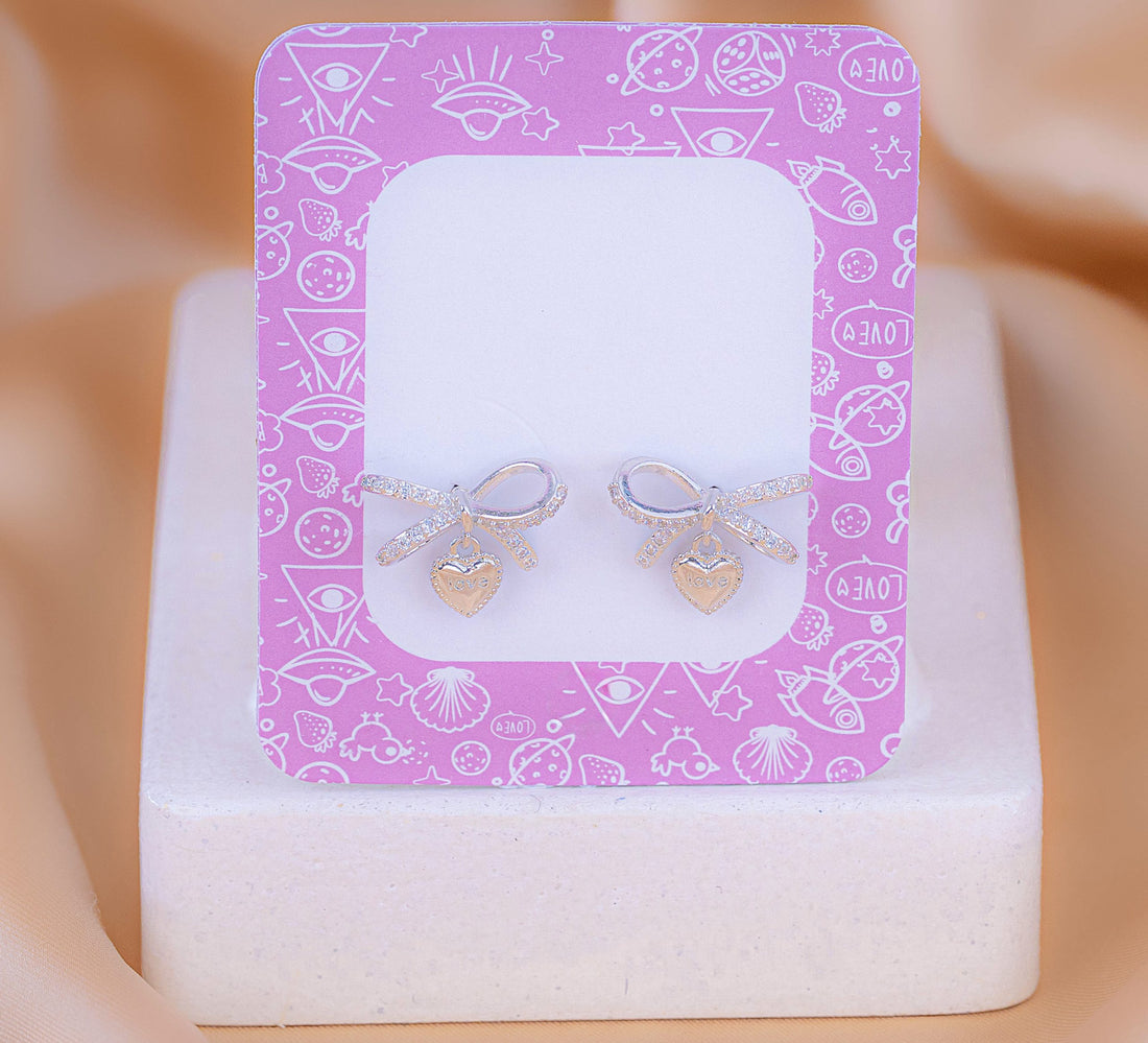 Aretes Lazo Corazón Plateado